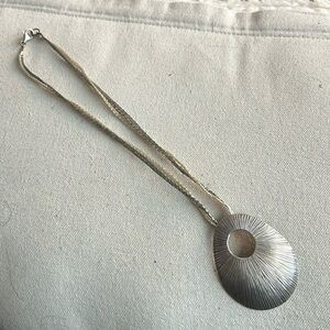 Necklace with silver medallion